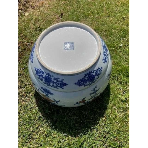 76 - A LARGE CHINESE UNDERGLAZE-BLUE AND COPPER-RED CENSER circular, painted with a Key pattern border ar... 