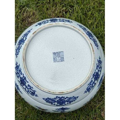 76 - A LARGE CHINESE UNDERGLAZE-BLUE AND COPPER-RED CENSER circular, painted with a Key pattern border ar... 