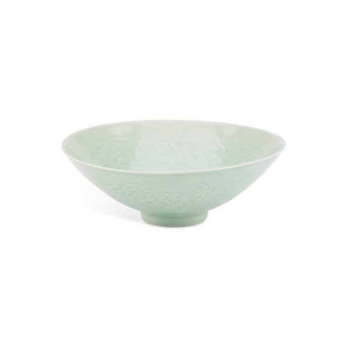 86 - A CHINESE CELADON-GROUND BOWL with incised and moulded decoration. 21cm diameterNo chips, cracks or ... 