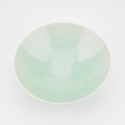 86 - A CHINESE CELADON-GROUND BOWL with incised and moulded decoration. 21cm diameterNo chips, cracks or ... 