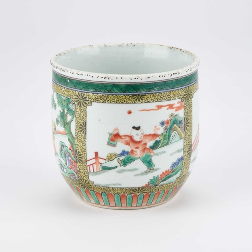 90 - A CHINESE FAMILLE VERTE BRUSHPOT decorated with four reserves, each depicting a boy. 12cm high... 