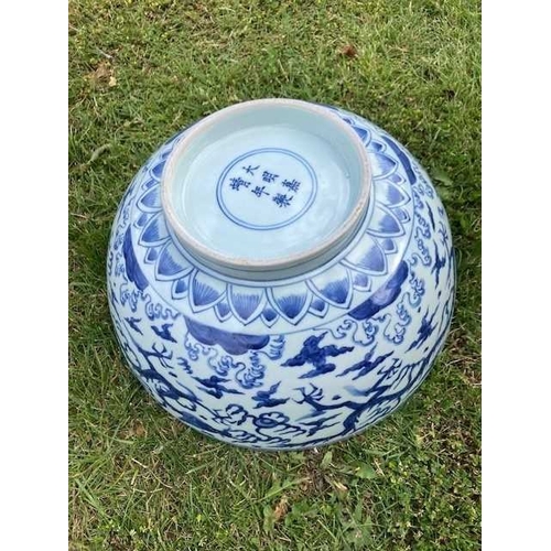 91 - A LARGE CHINESE BLUE AND WHITE BOWL bearing Jiajing mark and possibly of the period, the exterior pa... 