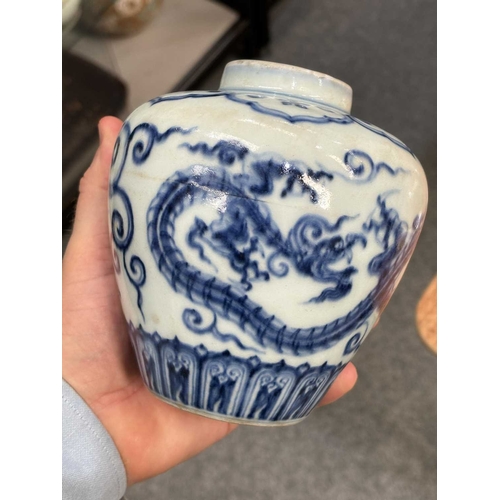 97 - A CHINESE BLUE AND WHITE 'DRAGON' JAR the tapering body underglaze blue painted with two dragons, be... 