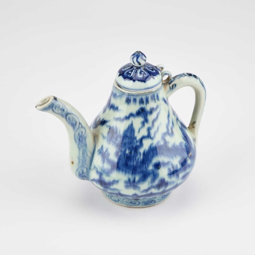 99 - A CHINESE BLUE AND WHITE TEAPOT with a domed cover and dragon-decorated body. 14cm high