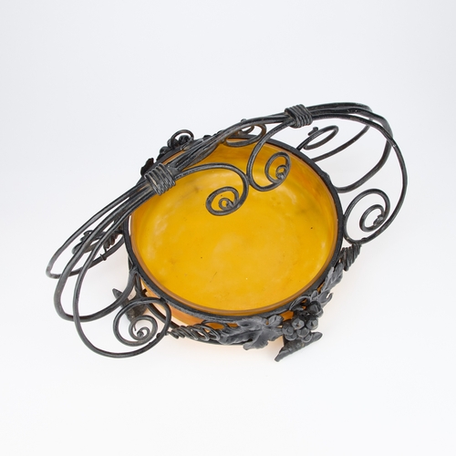 16 - A MULLER FRÃRES GLASS BOWL IN AN IRONWORK STAND the orange mottled glass bowl in an ironwork stand ... 