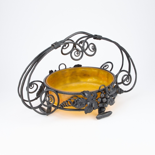 16 - A MULLER FRÃRES GLASS BOWL IN AN IRONWORK STAND the orange mottled glass bowl in an ironwork stand ... 