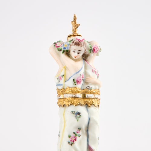 27 - A RARE CHELSEA PORCELAIN FIGURAL SCENT BOTTLE AND BODKIN CASE, CIRCA 1760 modelled as the three grac... 