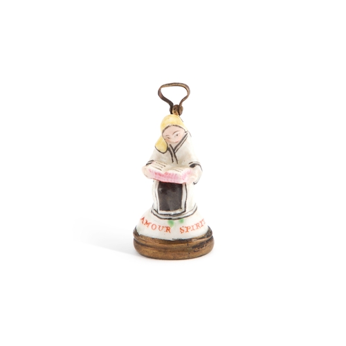 40 - A CHELSEA SEAL, CIRCA 1760 modelled as a seated nun, inscribed AMOUR SPIRITUEL. 3.5cm high... 