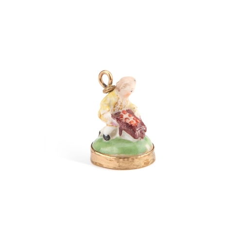 43 - A CHELSEA SEAL, CIRCA 1760 modelled as a boy with a barrow. 2.6cm high