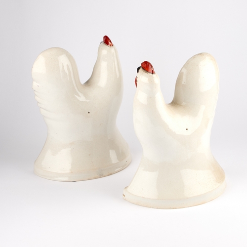 48 - A LARGE PAIR OF STAFFORDSHIRE POTTERY COCKERELS, CIRCA 1860 the white ground body moulded with feath... 