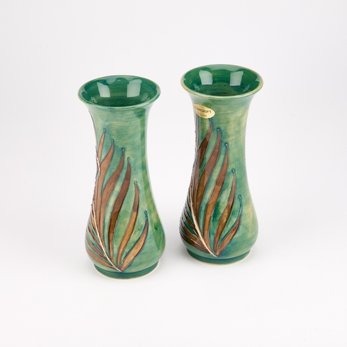 51 - A PAIR OF MOORCROFT POTTERY VASES, DESIGNED BY SALLY TUFFIN FOR LIBERTY & CO tubelined and hand-pain... 