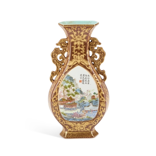 57 - A CHINESE FAUX BRONZE PORCELAIN VASE decorated with two landscape reserves, the ground richly gilded... 