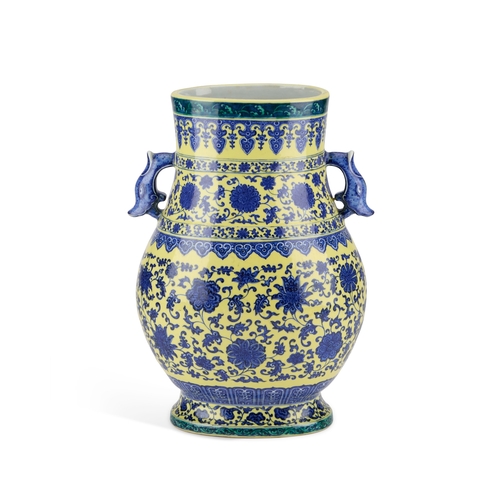 60 - A LARGE MING STYLE VASE, HU decorated in underglaze blue and yellow with scrolling foliage, bears un... 