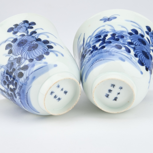 66 - A PAIR OF CHINESE BLUE AND WHITE WINE CUPS of inverted bell form, painted with flying insects and fl... 