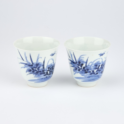 66 - A PAIR OF CHINESE BLUE AND WHITE WINE CUPS of inverted bell form, painted with flying insects and fl... 