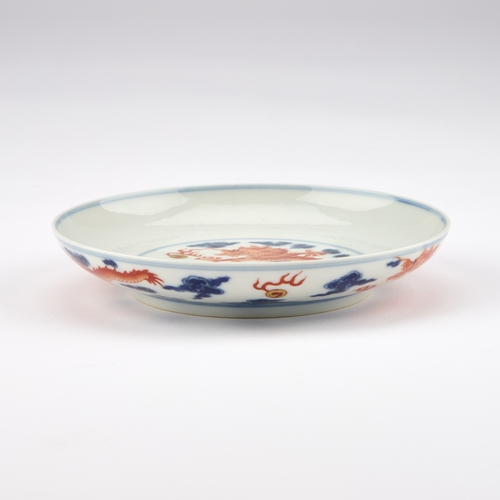 72 - A CHINESE UNDERGLAZE BLUE AND IRON-RED 'DRAGON' DISH 16cm diameter