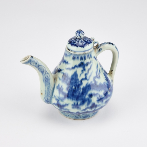 78 - A CHINESE BLUE AND WHITE TEAPOT with a domed cover and dragon-decorated body. 14cm high