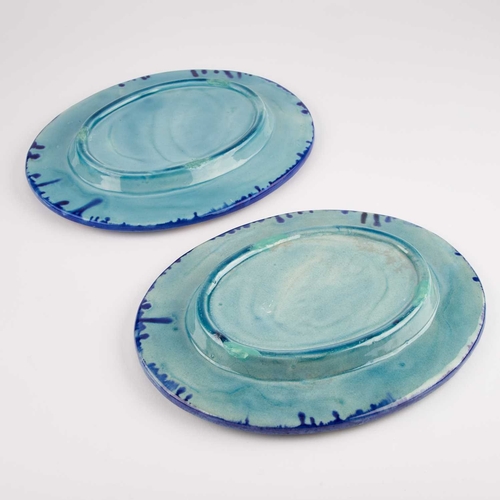 105 - A PAIR OF CONTINENTAL MAJOLICA OVAL DISHES each moulded with Classical figures. (2) 25.5cm long... 