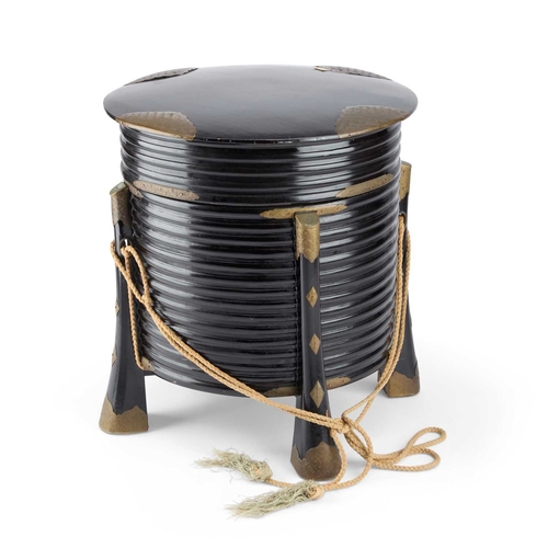 197 - A JAPANESE LACQUER STORAGE BOX (KARABITSU) of ribbed cylindrical form raised on four splayed support... 