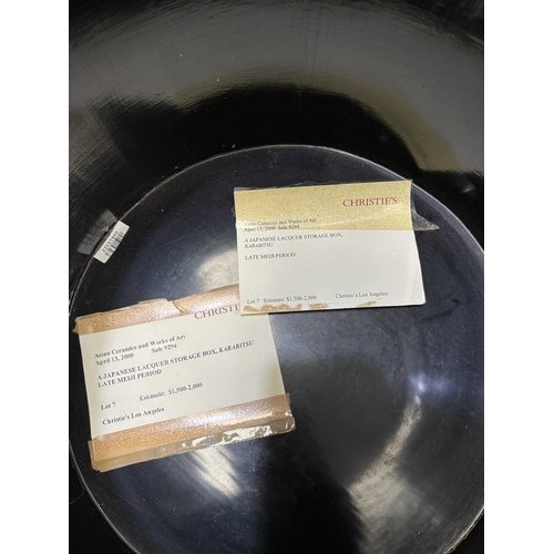 197 - A JAPANESE LACQUER STORAGE BOX (KARABITSU) of ribbed cylindrical form raised on four splayed support... 