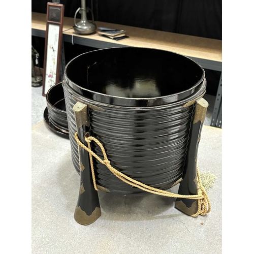 197 - A JAPANESE LACQUER STORAGE BOX (KARABITSU) of ribbed cylindrical form raised on four splayed support... 