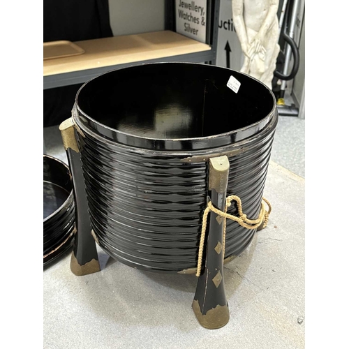 197 - A JAPANESE LACQUER STORAGE BOX (KARABITSU) of ribbed cylindrical form raised on four splayed support... 