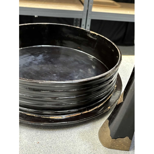 197 - A JAPANESE LACQUER STORAGE BOX (KARABITSU) of ribbed cylindrical form raised on four splayed support... 