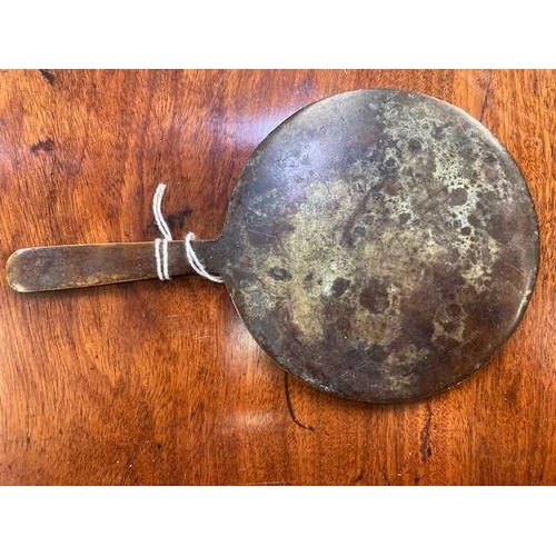 204 - A CHINESE BRONZE MIRROR, POSSIBLY LIAO DYNASTY the circular mirror with a tapering handle, decorated... 