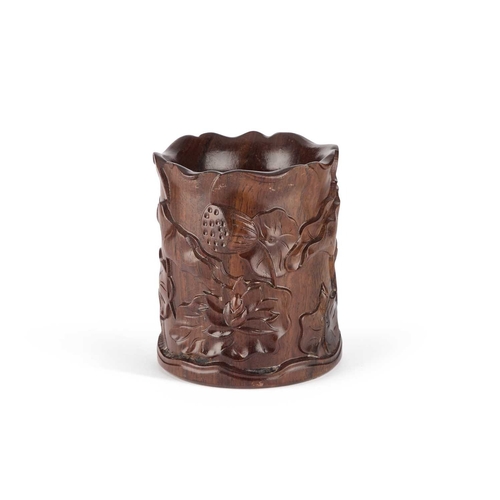 211 - A CHINESE HARDWOOD BRUSH POT, BITONG carved with foliage. 13.5cm high