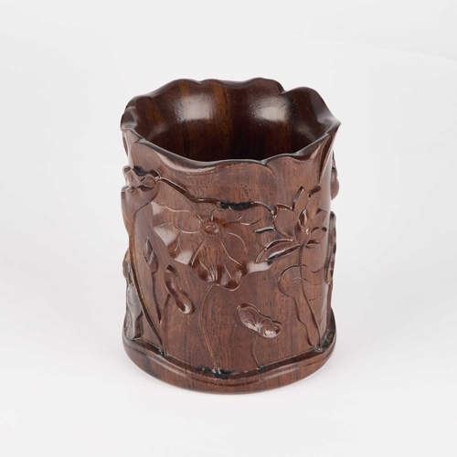 211 - A CHINESE HARDWOOD BRUSH POT, BITONG carved with foliage. 13.5cm high