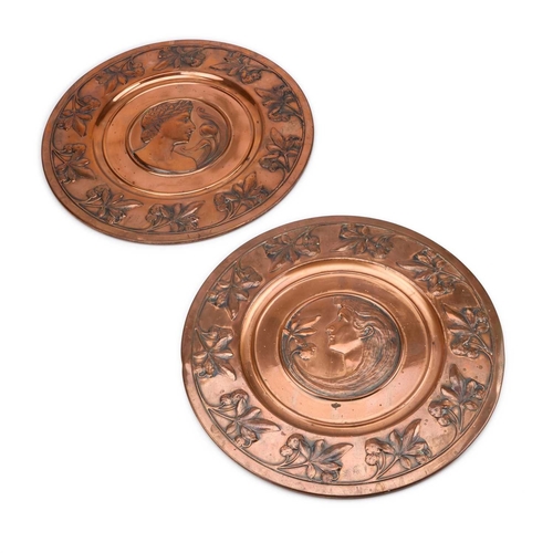 220 - A LARGE PAIR OF ARTS AND CRAFTS COPPER CHARGERS (2) 43.5cm diameter
