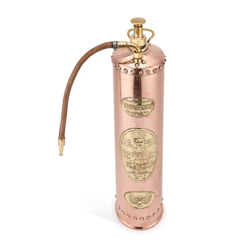 228 - A 'WATERLOO' COPPER AND BRASS FIRE EXTINGUISHER 72cm high