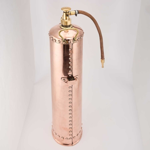 228 - A 'WATERLOO' COPPER AND BRASS FIRE EXTINGUISHER 72cm high