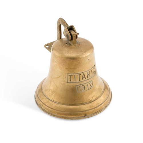 230 - A BRASS SHIP'S BELL bears the inscription TITANIC and the date 1912, with a wall-mounting bracket. 2... 
