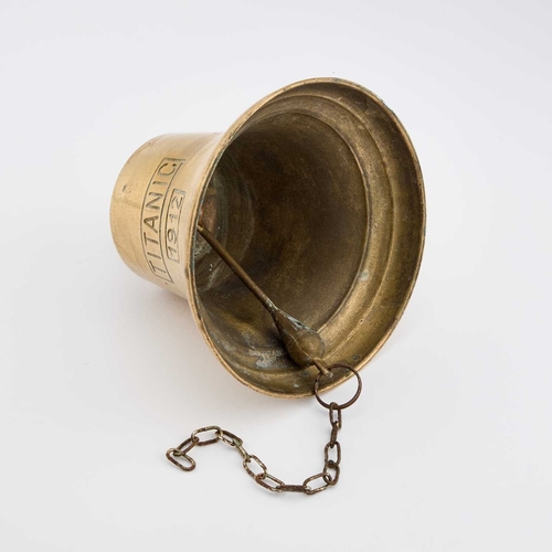 230 - A BRASS SHIP'S BELL bears the inscription TITANIC and the date 1912, with a wall-mounting bracket. 2... 