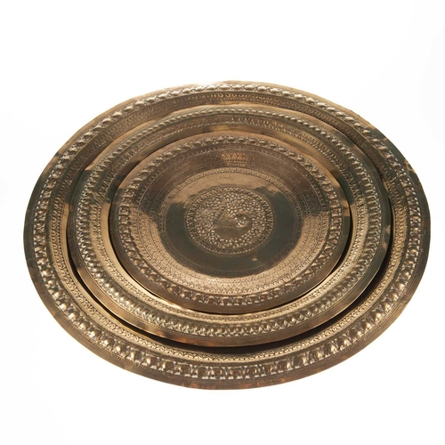 231 - THREE ISLAMIC BRASS TRAYS the largest 60cm diameter (3)