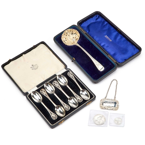 238 - A GEORGE III SILVER SIFTING LADLE by Thomas Wilkes Barker, London 1811, the bowl now chased, in a fi... 