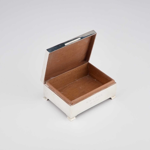 243 - AN ELIZABETH II SILVER CIGARETTE BOX by E S & Co, Birmingham 1952. 11.5cm long, 9.7 troy ounces ... 