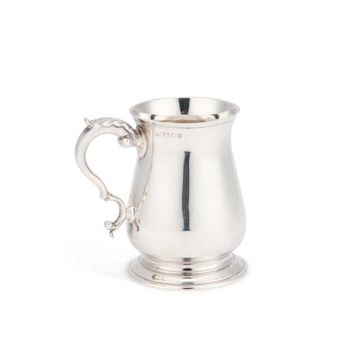 244 - A GEORGIAN STYLE SILVER MUG by Richard Comyns, London 1958. 10.5cm high, 7 troy ounces... 