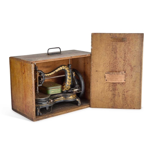 351 - A VICTORIAN JONES HAND SEWING MACHINE complete with a pine travelling case. Case 42cm wide... 