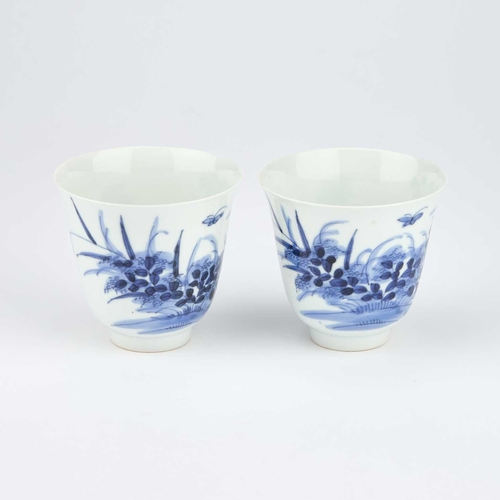 124 - A PAIR OF CHINESE BLUE AND WHITE WINE CUPS of inverted bell form, painted with flying insects and fl... 