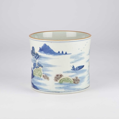 125 - A CARVED UNDERGLAZE-BLUE, COPPER-RED AND CELADON-GLAZED 'LANDSCAPE' BRUSH POT, BITONG decorated arou... 