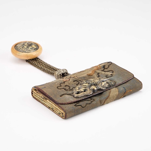 170 - A JAPANESE TABAKO-IRE (TOBACCO POUCH) WITH KAGAMIBUTA NETSUKE worked with a dragon, the brass mae-ka... 