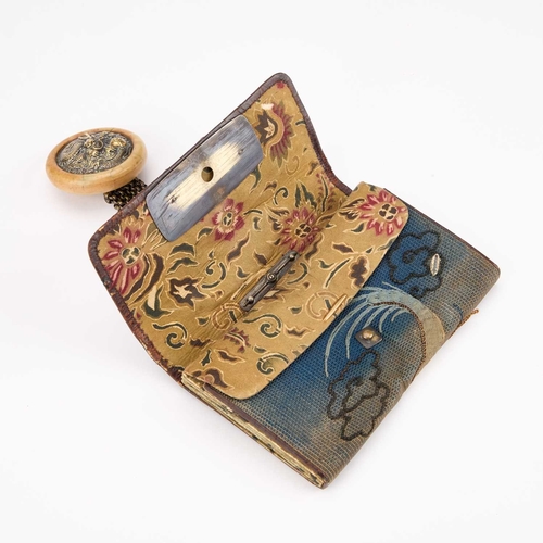 170 - A JAPANESE TABAKO-IRE (TOBACCO POUCH) WITH KAGAMIBUTA NETSUKE worked with a dragon, the brass mae-ka... 