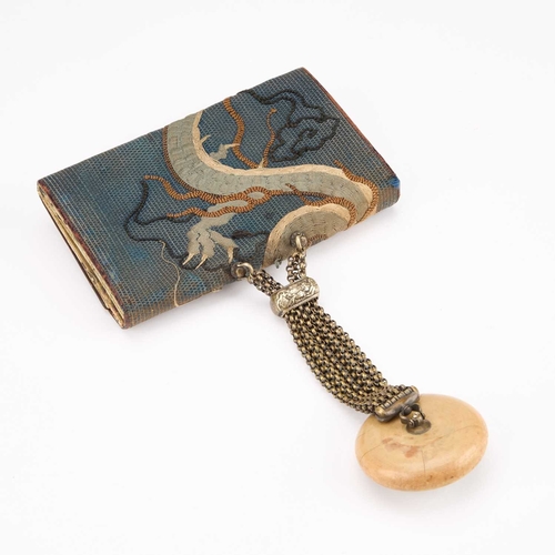 170 - A JAPANESE TABAKO-IRE (TOBACCO POUCH) WITH KAGAMIBUTA NETSUKE worked with a dragon, the brass mae-ka... 