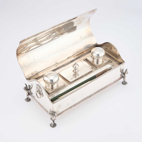 190 - A HANDSOME GEORGIAN STYLE SILVER-PLATED INKSTAND late 19th Century, with lion-mask ring handles and ... 