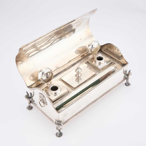 190 - A HANDSOME GEORGIAN STYLE SILVER-PLATED INKSTAND late 19th Century, with lion-mask ring handles and ... 