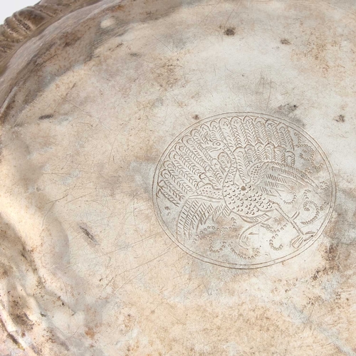 201 - A LARGE BURMESE SILVER BOWL the deep rounded sides embossed in high relief with figures. 17.5cm high... 