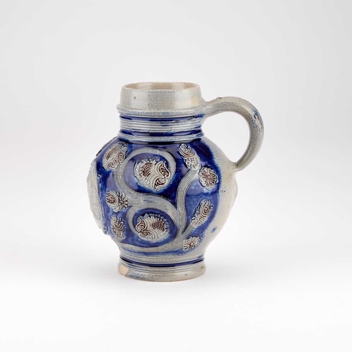 22 - A WESTERWALD STONEWARE JUG circa 1700, of almost globular form, applied with an oval titled equestri... 