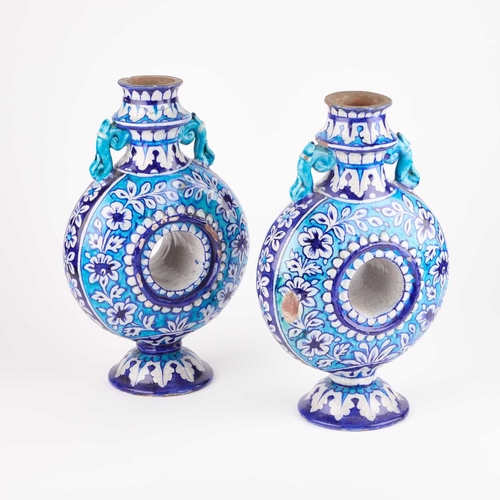 27 - BOMBAY SCHOOL OF ARTS: A PAIR OF POTTERY FLASKS IN THE MULTAN STYLE, INDIA, CIRCA 1880 (2) 29cm high... 